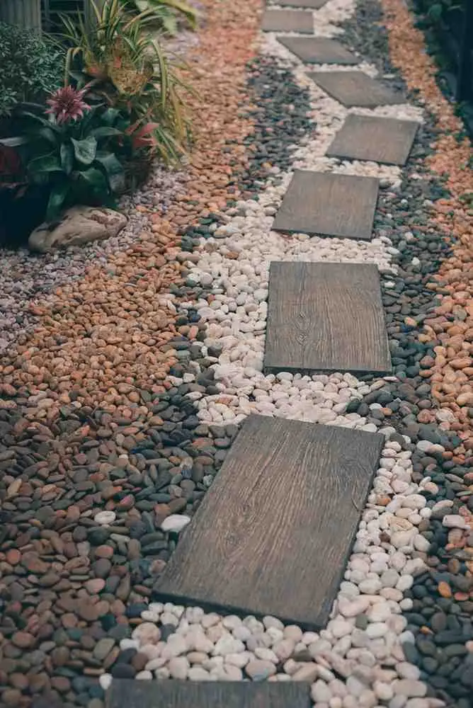 River Rock Landscaping Ideas with modern stepping stone pathway and mixed color decorative rocks